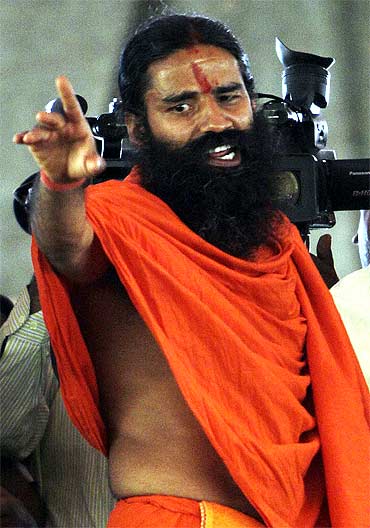 Swami Ramdev speaks during a news conference