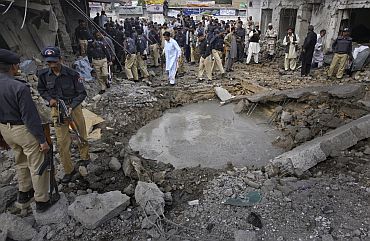 Security officials survey the site of a suicide bomb blast in Quetta, Pakistan on April 7, which killed at least one man and wounded four others