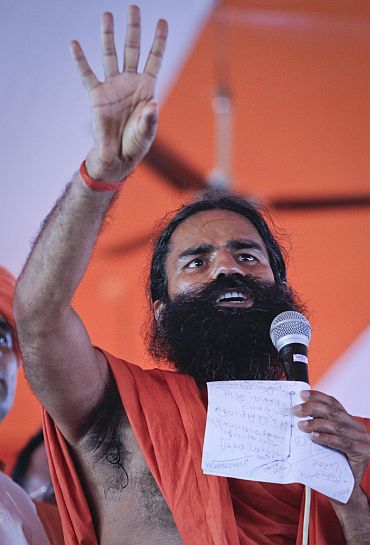 Yoga guru Ramdev addresses his supporters at the Ramlila grounds in New Delhi on Friday