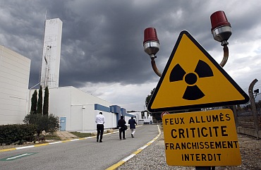 A warning sign is posted next to of the building which houses the plutonium fuel fabrication facility in Cadarache, southern France