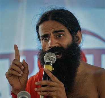 Yoga guru Swami Ramdev addresses his supporters during his fast against corruption