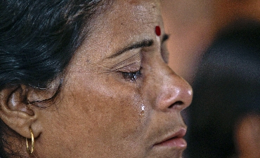 Tears roll down the face of a Ramdev supporter