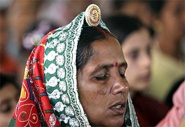 A Baba Ramdev supporter weeps on hearing news of his hospitalisation