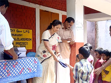 Dr Sunil distributes books among school children