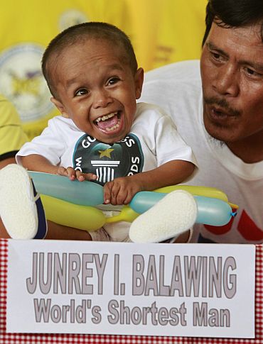 Reynaldo Balawing talks to his son Junrey in Sindangan, Zamboanga del Norte in southern Philippines