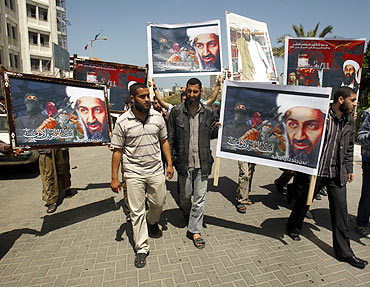 Palestinians, holding pictures depicting Osama bin Laden, protest in Gaza city