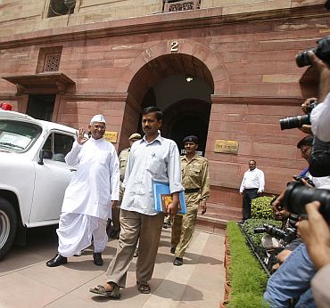 Civil society members Anna Hazare and Arvind Kejriwal after attending a meeting of the joint drafting committee of Jan Lokpal bill in New Delhi