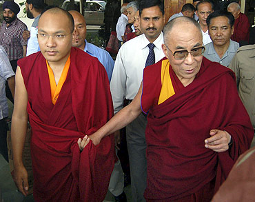 The Karmapa Lama with the Dalai Lama at the Kangra airport on the outskirts of Dharamsala on May 16, 2011
