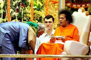 File photo of Ustad Amjad Ali Khan recieving blessings of Sathya Sai Baba