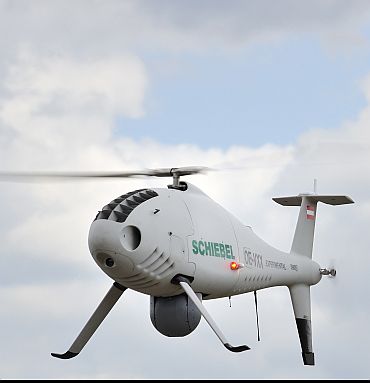 Schiebel's next-generation Camcopter UAV helicopter in flight. The Camcopter S-100 is a medium -range, medium endurance VTOL UAV system designed to provide a unique balance between advanced capabilities and operation in tactical environments