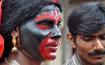A devotee paints her face like Maa Kamakhya