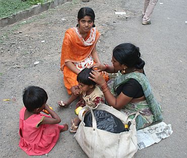 A mother with her three daughters at a health centre in Parli
