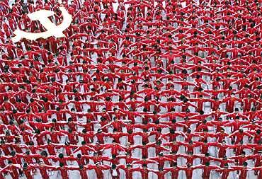 Students in school uniforms link their arms to form the flag of CPC, in celebration of the party's 90th anniversary