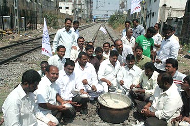 Telangana Joint Action Committee members organise 'rail roko' near Secunderabad station on Tuesday
