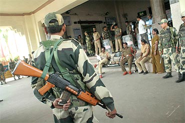 Security personnel stand guard at the Hyderabad station