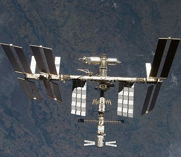 The International Space Station is seen from Space Shuttle Discovery as the two spacecraft begin their relative separation