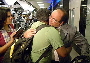 An Indian rescued from Libya reunites with his family at the Mumbai airport
