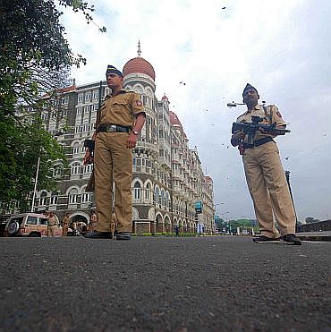 Policemen guard the Taj Mahal Hotel in south Mumbai, which was attacked on 26/11