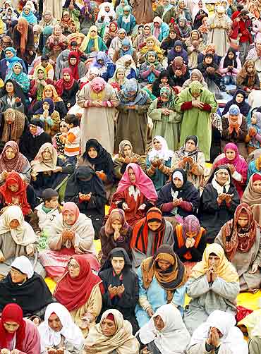 A group of women pray in Srinagar