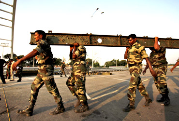 The Indian Army rebuilds a collapsed pedestrian bridge before the Commonwealth Games