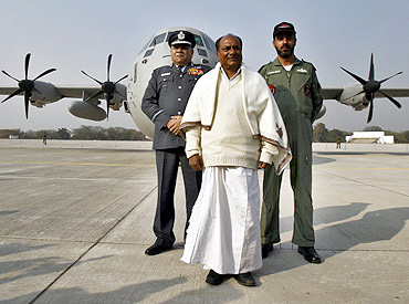 Defence Minister A K Antony and Air Chief Marshal P V Naik pose with the Super Hercules aircraft