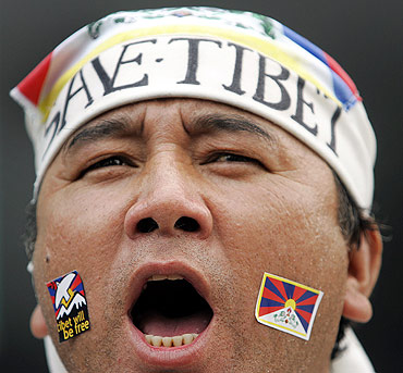 A Tibetan activist shouts slogans during a rally in Taipei