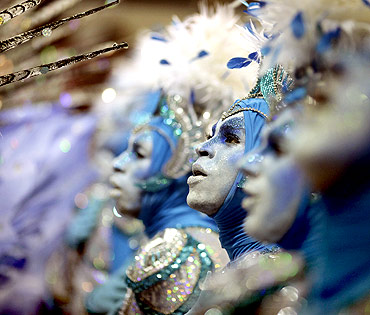 Revellers of the Portela samba school participate in the annual Carnival parade