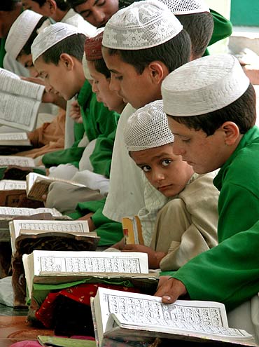 Muslim boys read the Koran at a madrasa in Jammu