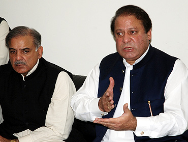 Nawaz Sharif (right), with his brother  Shahbaz Sharif, at a press conference in Lahore