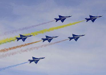 J-7GB fighter jet aerobatic team of China Air Force performs a manoeuvre during a rehearsal near an airport on the outskirts of Beijing