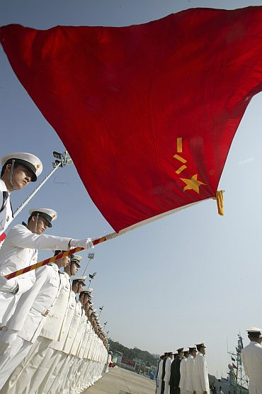 Chinese People's Liberation Army naval troops stand in attention during the annual rotation of military personnel in Hong Kong