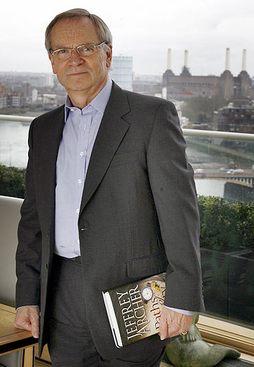Jeffrey Archer poses for a photograph at his apartment in London
