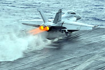 An F/A-18F Super Hornet launches during flight operations aboard the aircraft carrier USS Enterprise in the Red Sea