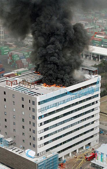 An office building burns in Tokyo after an earthquake