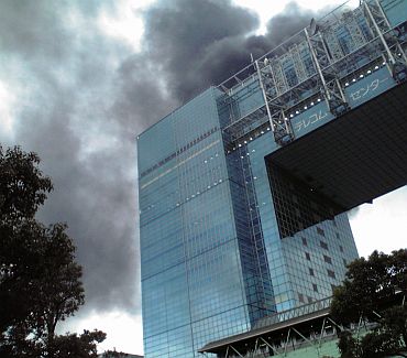 A building burns after an earthquake in the Odaiba district of Tokyo