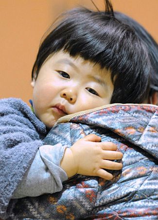 A child who evacuated from the vicinity of Fukushima Daiichi Nuclear Plant is pictured in Kawamata