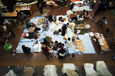 People are given first aid at a Japanese Red Cross hospital