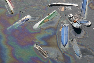 Oil leaks from ships swept by a tsunami in Fudai Village, Iwate Prefecture in northern Japan