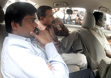 Sadiq Batcha is taken away from his residence for questioning by CBI after a raid in Chennai on December 8, 2010