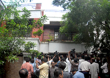 Television cameramen fight for space outside the residence of Sadiq Batcha during a CBI raid in Chennai