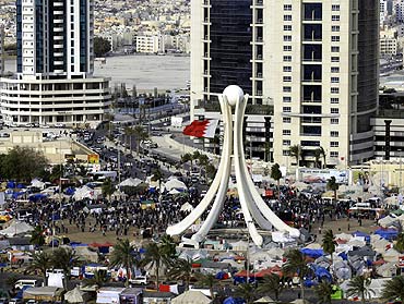 Protesters are seen at Pearl Square as GCC forces move in to evacuate the area in Manama