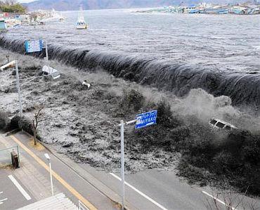 A wave approaches Miyako City from the Heigawa estuary in Iwate Prefecture after the magnitude 8.9 earthquake struck the area March 11