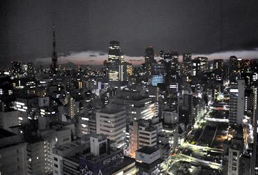 Lights are turned off to save energy before rolling blackouts in Tokyo