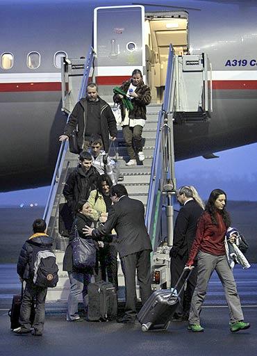 The Czech Republic's Defence Minister Alexander Vondra welcomes evacuees from Japan at Kbely military airport in Prague