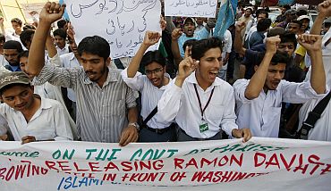 Students shout slogans as they take part in a protest in Karachi