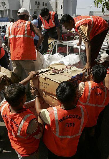 Members of a rescue team from the Gujarat State Disaster Management Authority