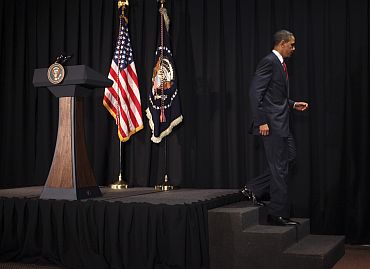 US President Barack Obama walks from a lectern after announcing limited US military operations against Libya, in Brasilia