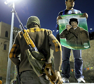 A soldier from the Libyan army loyal to Gaddafi stands at Green Square in Tripoli.