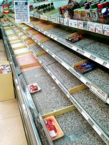 Near-empty shelves at a supermarket in Tokyo