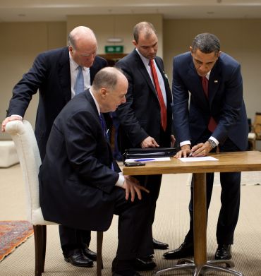President Barack Obama works on his statement concerning the situation in Libya with, from left, Chief of Staff Bill Daley, National Security Advisor Tom Donilon, and Deputy National Security Advisor for Strategic Communication Ben Rhodes